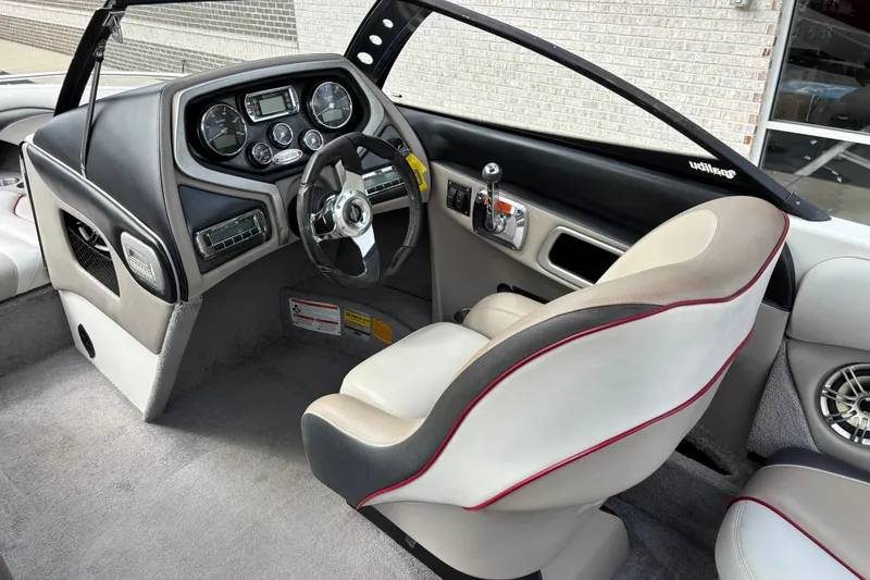 Slide: The Image of 2008 Malibu Wakesetter 23 LSV interior with steering wheel and dashboard controls. - 8