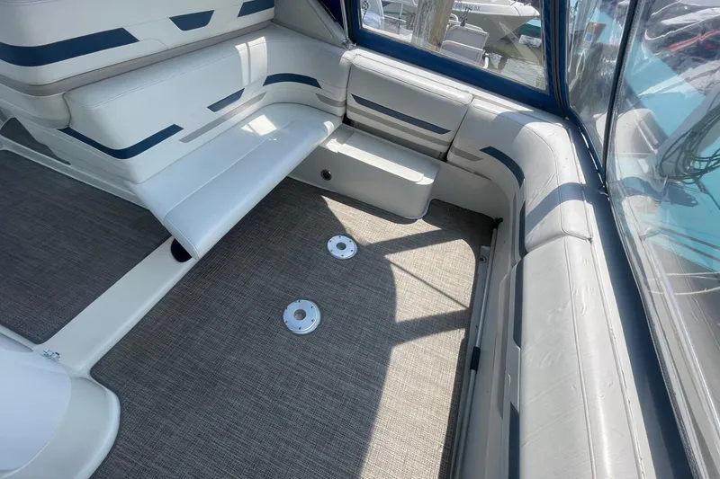 Slide: The Image of 1999 Formula 31 Performance Cruiser interior with seating and sink, featuring modern design elements. - 10