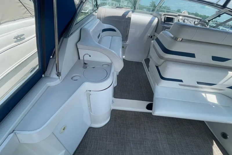 Slide: The Image of 1999 Formula 31 Performance Cruiser interior with seating and sink area. - 11