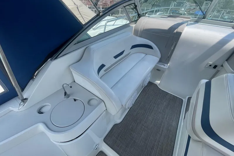 Slide: The Image of 1999 Formula 31 Performance Cruiser interior with white seating and control panel. - 12