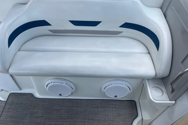 Slide: The Image of 1999 Formula 31 Performance Cruiser interior with white seating and blue accents. - 14