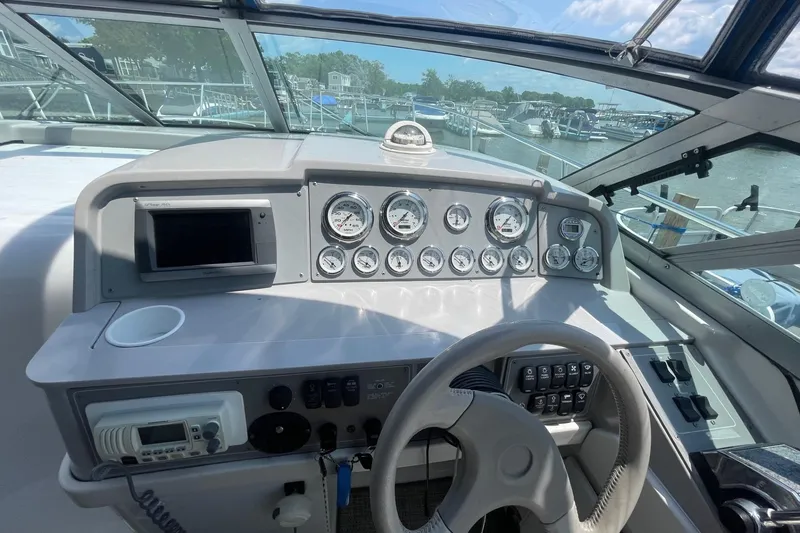 Slide: The Image of 1999 Formula 31 Performance Cruiser dashboard with Garmin GPSmap 740S and speedometer. - 17