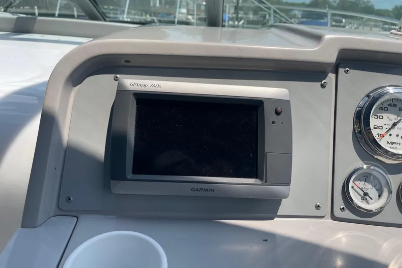 Slide: The Image of Dashboard of a 1999 Formula 31 Performance Cruiser with gauges and navigation system. - 18