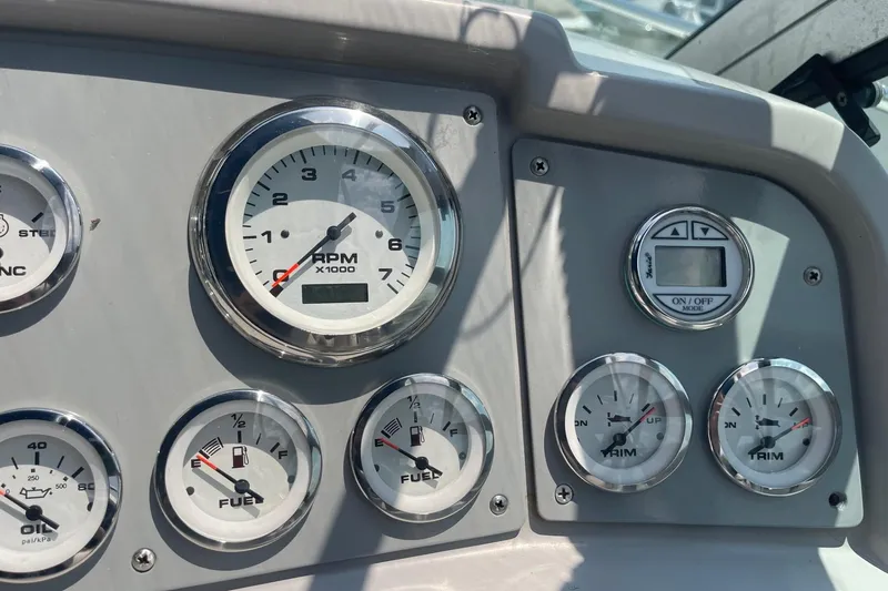 Slide: The Image of Control panel of a 1999 Formula 31 Performance Cruiser with switches and keys. - 20