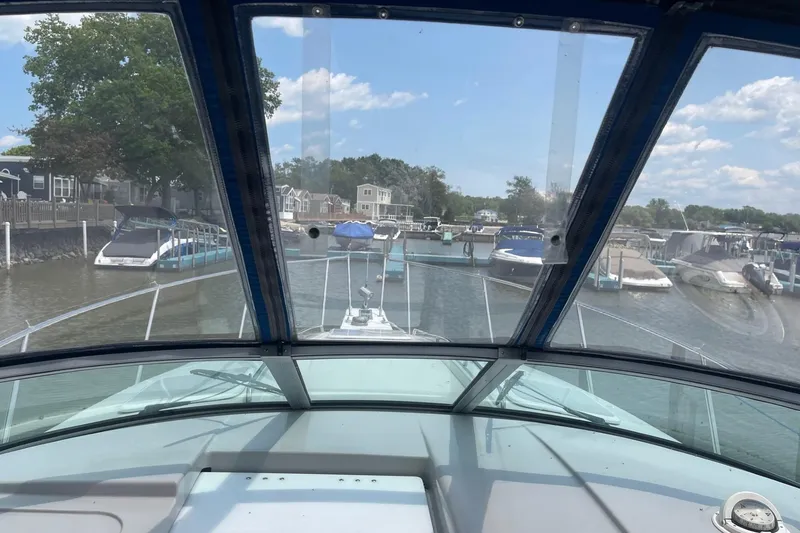 Slide: The Image of 1999 Formula 31 Performance Cruiser interior with seating and table, viewed from entrance. - 24