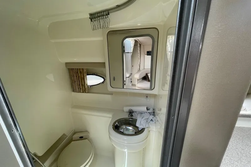 Slide: The Image of 1999 Formula 31 Performance Cruiser interior with cozy seating and dining area. - 31