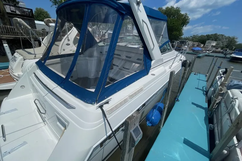 Slide: The Image of 1999 Formula 31 Performance Cruiser docked, featuring "The Adventure Continues" text, Marblehead, Ohio. - 7