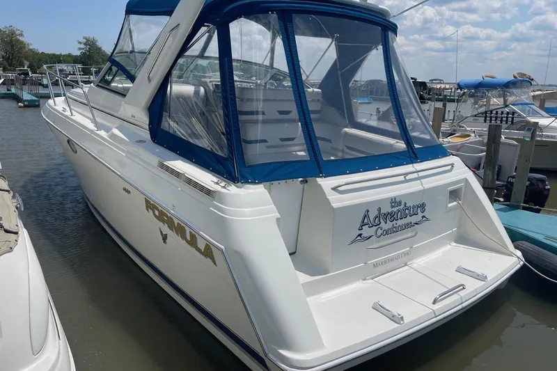 Slide: The Image of 1999 Formula 31 Performance Cruiser interior with white seating and carpeted floor. - 9