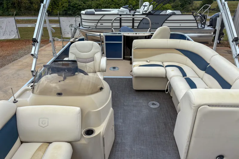 Slide: The Image of 2016 Godfrey Sweetwater 2086 C pontoon boat with spacious seating and modern dashboard. - 13