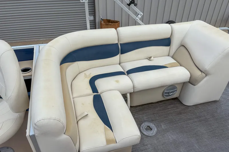 Slide: The Image of 2016 Godfrey Sweetwater 2086 C boat seating with beige and blue upholstery. - 8