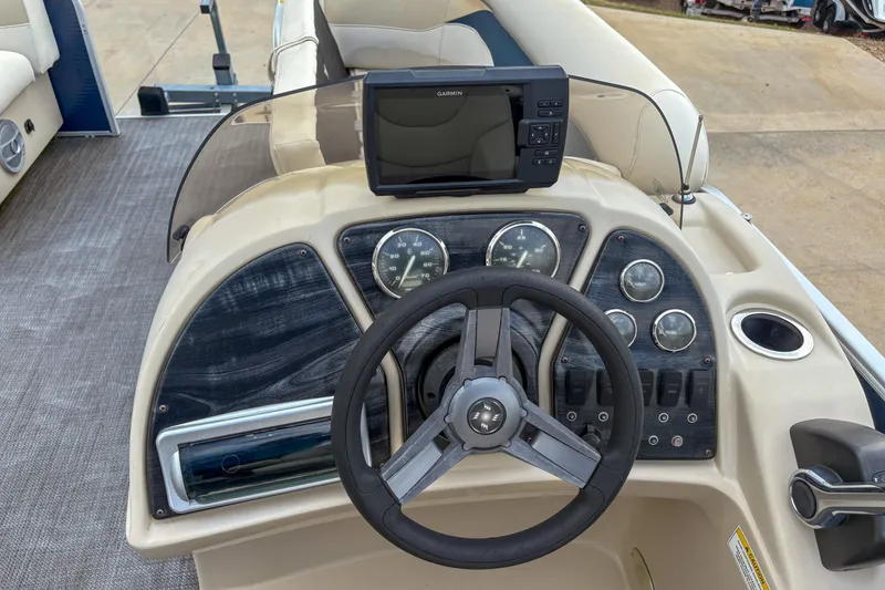 Slide: The Image of Steering console of 2016 Godfrey Sweetwater 2086 C boat with Garmin GPS. - 9