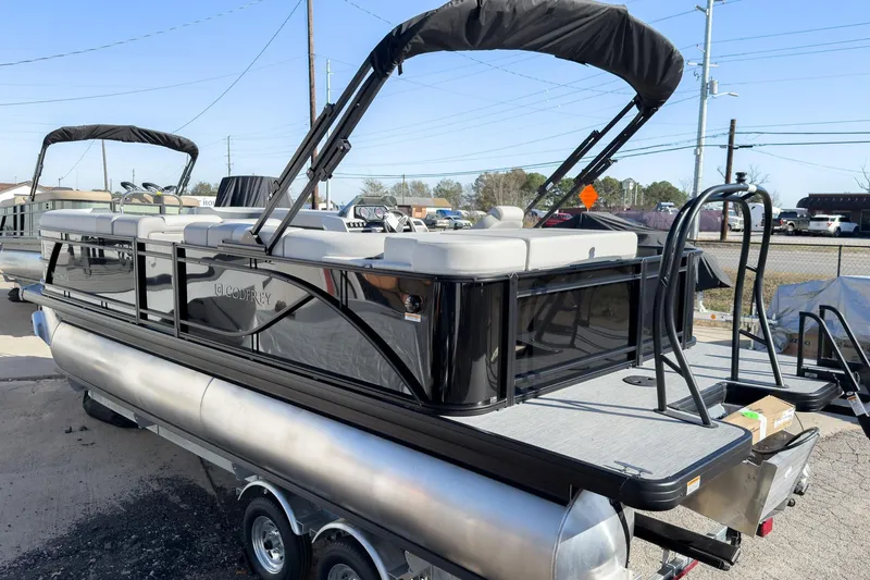 Slide: The Image of 2026 Godfrey Sweetwater 20' Cruise Special Edition Tritoon, sleek design, parked on trailer. - 4