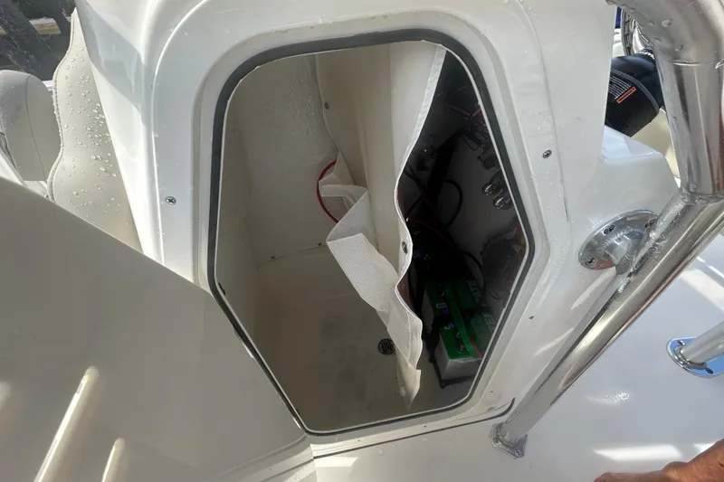 Slide: The Image of Open storage compartment on a 2026 Key West 203 FS boat, showing interior details. - 18