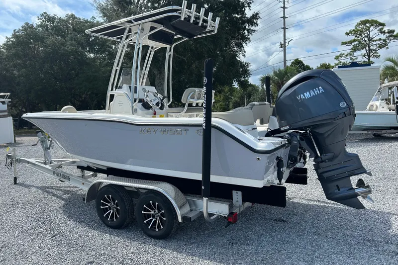 Slide: The Image of 2026 Key West 203 FS boat with Yamaha engine on trailer, parked outdoors. - 7