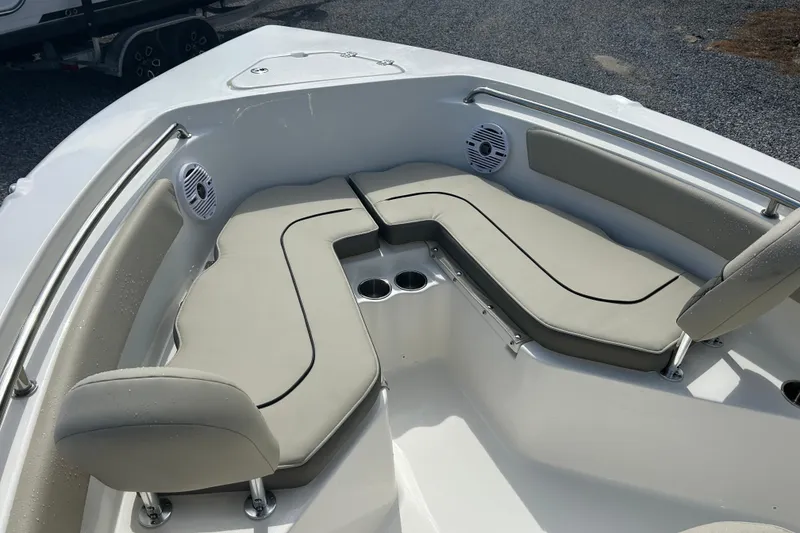 Slide: The Image of 2026 Key West 203 FS boat interior with cushioned seating and cup holders. - 8