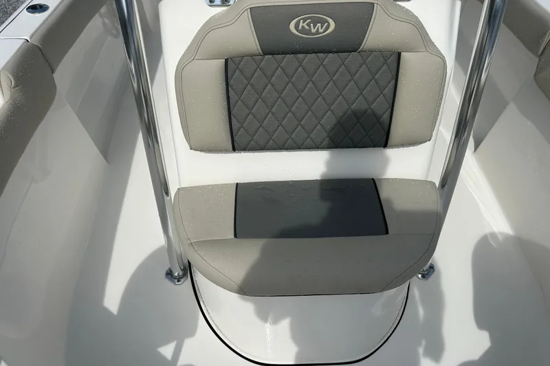 Slide: The Image of 2026 Key West 203 FS boat seat with gray and black cushioned design. - 9