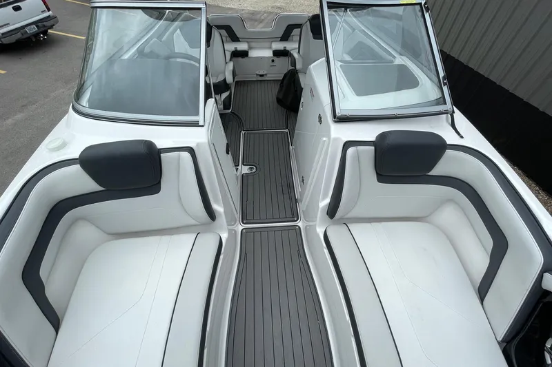 Slide: The Image of 2017 Yamaha 242 boat interior with white seating and sleek design. - 13