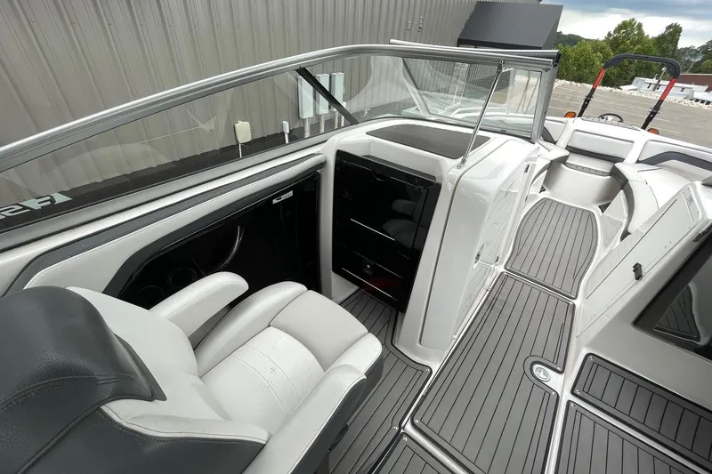 Slide: The Image of 2017 Yamaha 242 boat interior with sleek seating and modern dashboard design. - 9