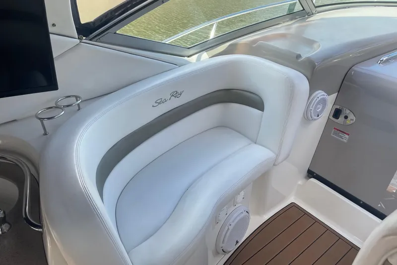 Slide: The Image of 2007 Sea Ray 320 Sundancer interior with white seating and wood flooring. - 12