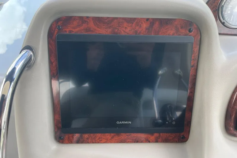 Slide: The Image of Garmin display on 2007 Sea Ray 320 Sundancer boat dashboard with wood trim. - 16
