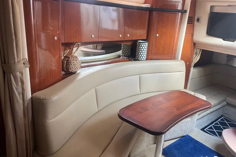 Slide: The Image of Luxurious interior of 2007 Sea Ray 320 Sundancer with elegant wood and leather finishes. - 26