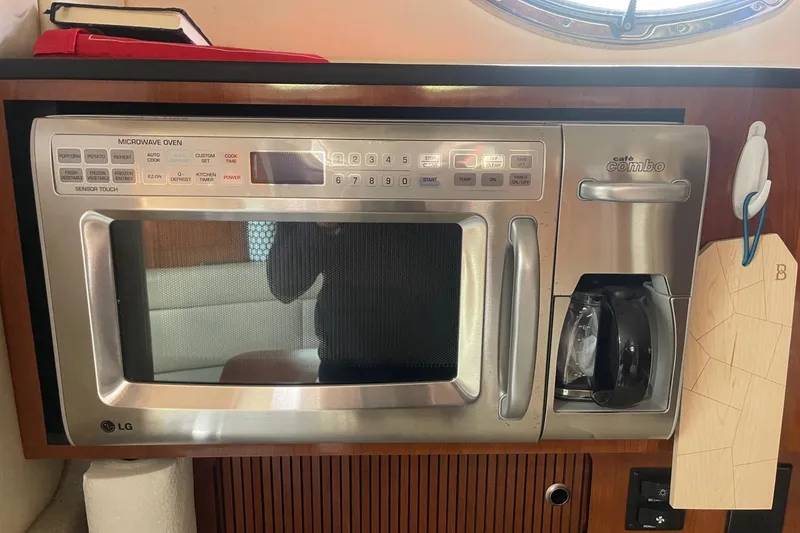 Slide: The Image of LG microwave and coffee maker in 2007 Sea Ray 320 Sundancer yacht kitchen. - 32