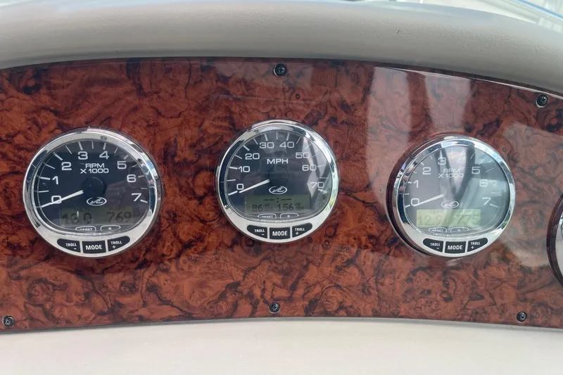 Slide: The Image of Dashboard of 2007 Sea Ray 320 Sundancer with RPM and speed gauges. - 33