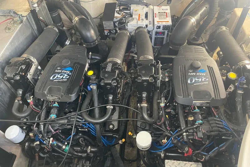 Slide: The Image of Engine compartment of a 2007 Sea Ray 320 Sundancer with twin MerCruiser 350 MAG MPI engines. - 34