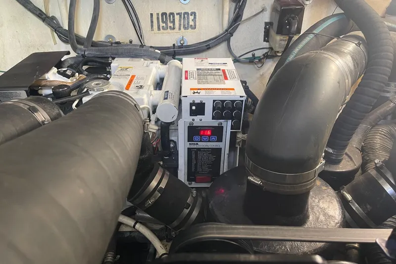 Slide: The Image of Engine compartment of a 2007 Sea Ray 320 Sundancer with visible components and wiring. - 38