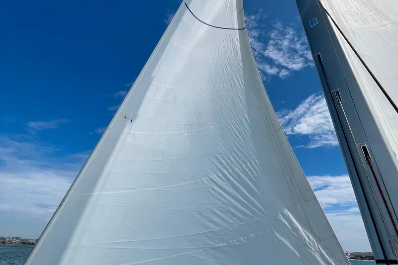 Slide: The Image of Sails of Jeanneau Sun Odyssey 44 DS 2013 against a clear blue sky. - 101