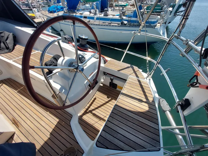 Slide: The Image of 2013 Jeanneau Sun Odyssey 44 DS sailboat docked at marina, side view. - 14