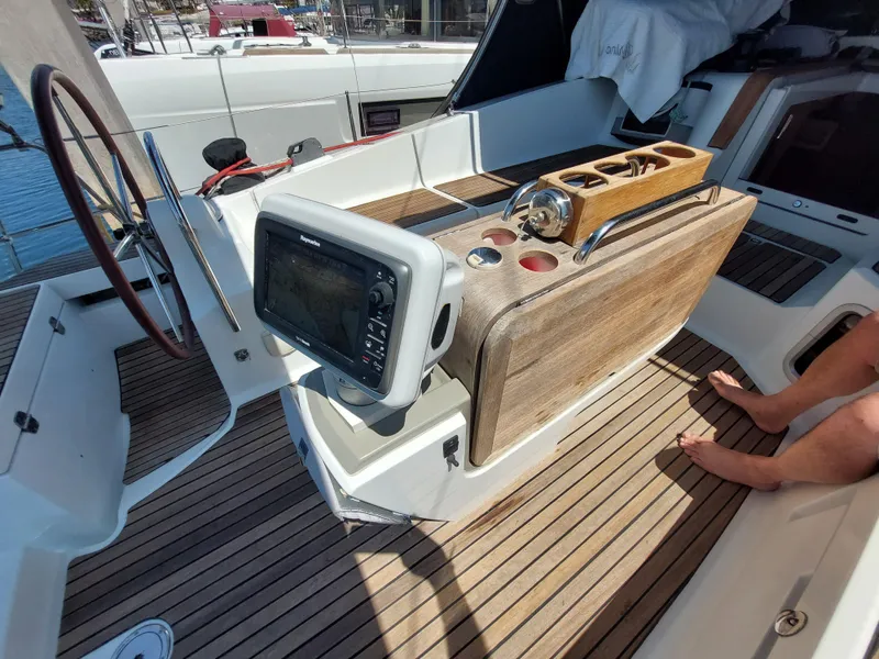 Slide: The Image of 2013 Jeanneau Sun Odyssey 44 DS sailboat docked in a marina, clear sky. - 16
