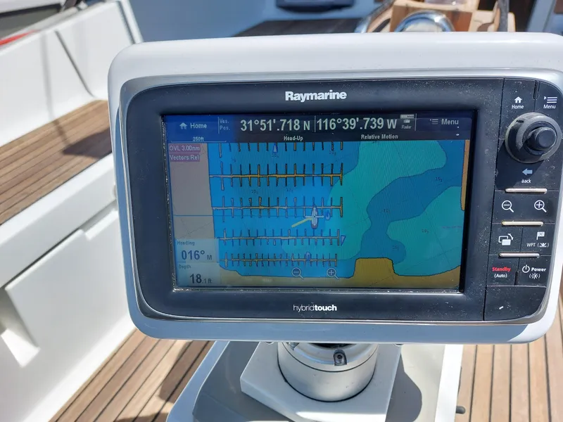 Slide: The Image of Jeanneau Sun Odyssey 44 DS 2013 sailboat docked in a marina, featuring dual steering wheels. - 17