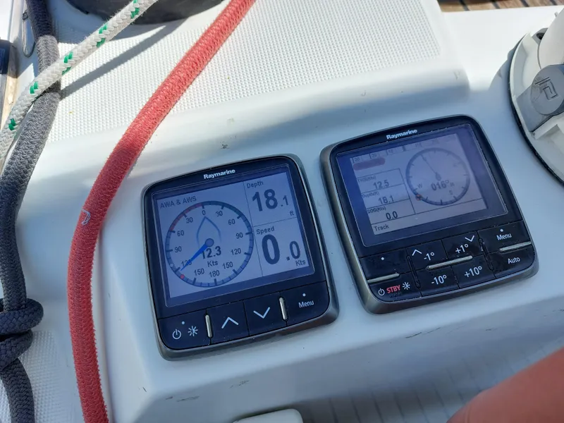 Slide: The Image of Steering wheel of 2013 Jeanneau Sun Odyssey 44 DS sailboat with wooden deck. - 18