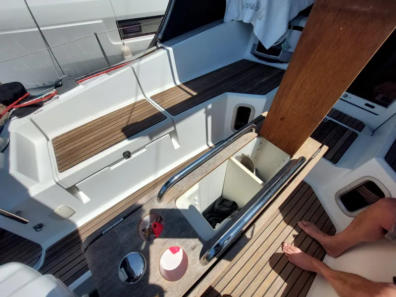 Slide: The Image of Deck of 2013 Jeanneau Sun Odyssey 44 DS sailboat with winches and navigation display. - 24