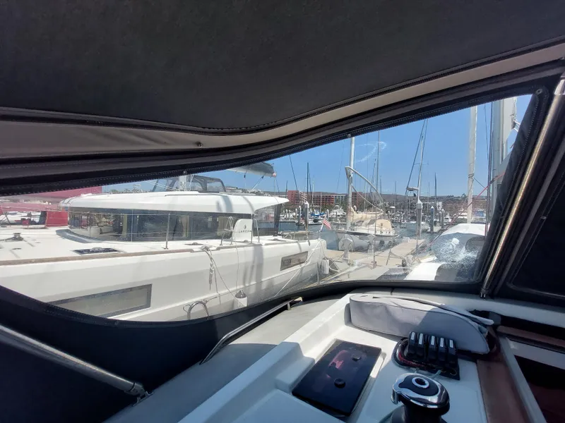 Slide: The Image of Storage compartment on 2013 Jeanneau Sun Odyssey 44 DS sailboat, containing various boating equipment. - 29