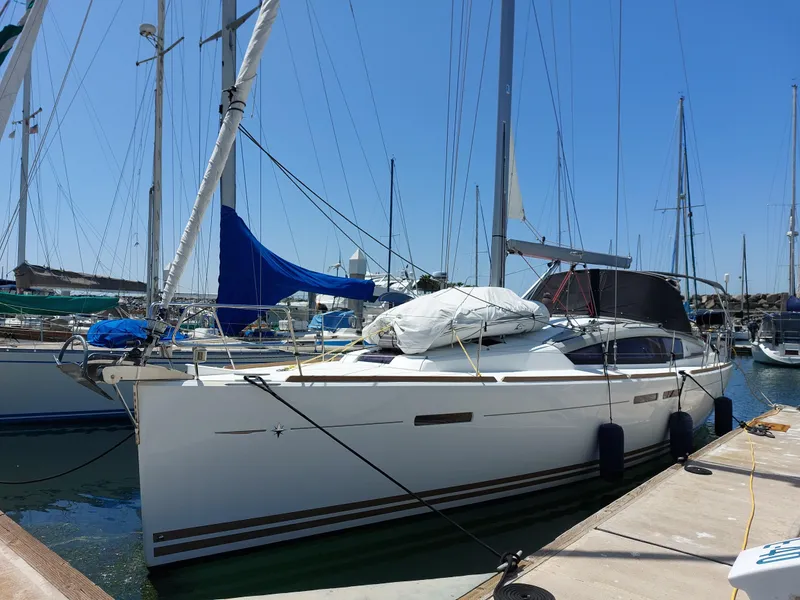 Slide: The Image of 2013 Jeanneau Sun Odyssey 44 DS sailboat on stands under clear blue sky. - 3