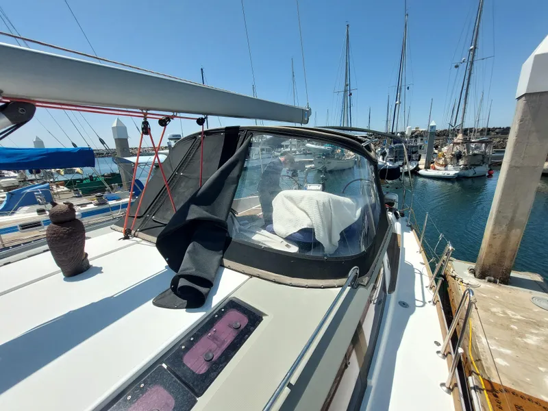 Slide: The Image of Cockpit of 2013 Jeanneau Sun Odyssey 44 DS sailboat with wooden flooring and open storage compartment. - 30