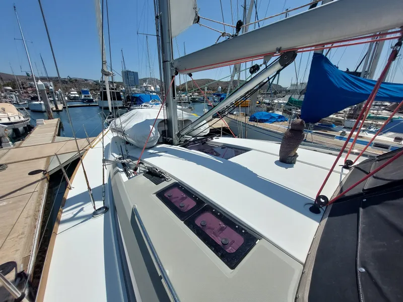 Slide: The Image of Cockpit of 2013 Jeanneau Sun Odyssey 44 DS sailboat with teak flooring and open hatch. - 31