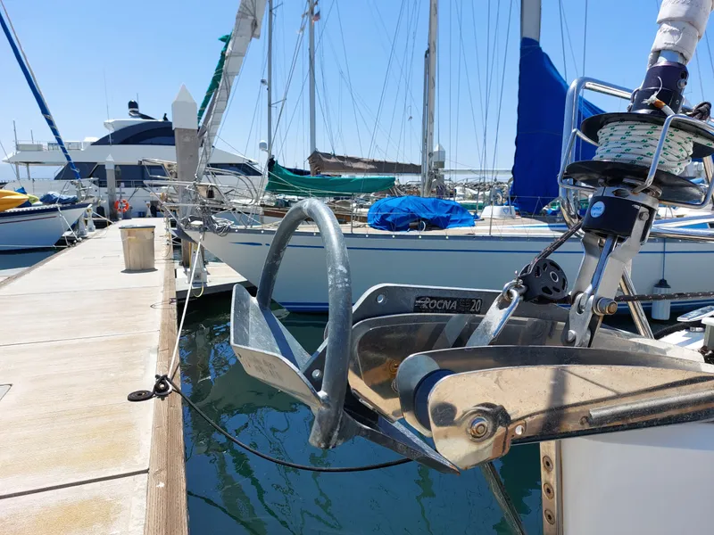 Slide: The Image of 2013 Jeanneau Sun Odyssey 44 DS sailboat docked at marina, showcasing deck and rigging. - 37