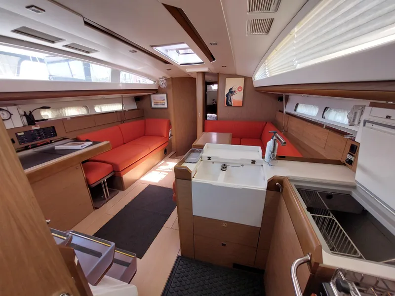 Slide: The Image of 2013 Jeanneau Sun Odyssey 44 DS docked, showcasing deck and rigging details. - 39