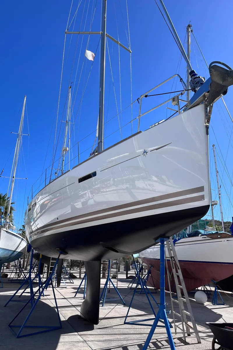 Slide: The Image of Jeanneau Sun Odyssey 44 DS yacht docked at marina, 2013 model, side view. - 4