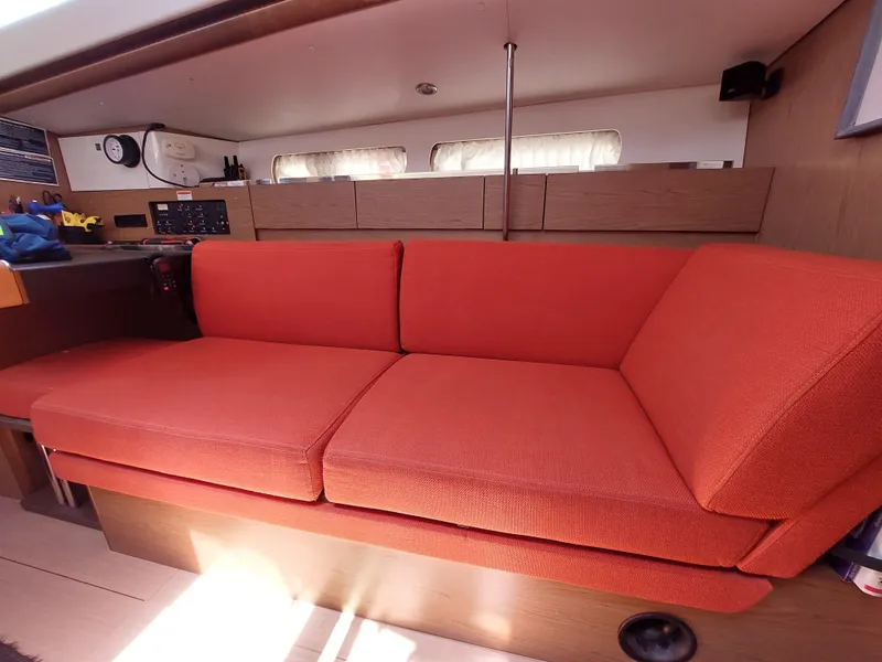 Slide: The Image of 2013 Jeanneau Sun Odyssey 44 DS sailboat docked in a marina, surrounded by other boats. - 42