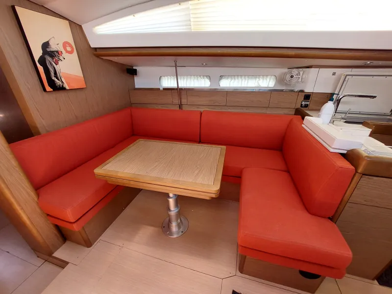 Slide: The Image of Jeanneau Sun Odyssey 44 DS 2013 yacht docked, showcasing anchor and marina setting. - 44