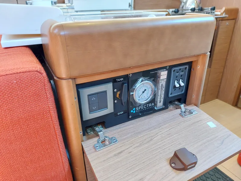 Slide: The Image of Interior of 2013 Jeanneau Sun Odyssey 44 DS yacht with red seating and wooden finishes. - 47