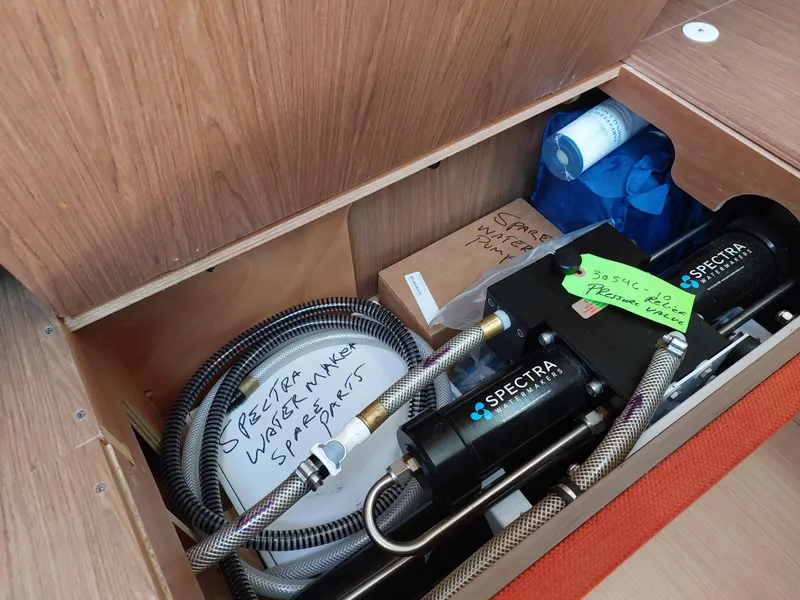 Slide: The Image of Interior of 2013 Jeanneau Sun Odyssey 44 DS sailboat with red seating and wooden finishes. - 50