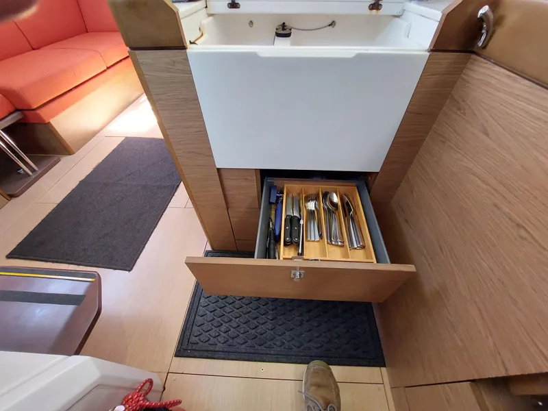 Slide: The Image of Interior of 2013 Jeanneau Sun Odyssey 44 DS yacht with modern kitchen and seating area. - 53
