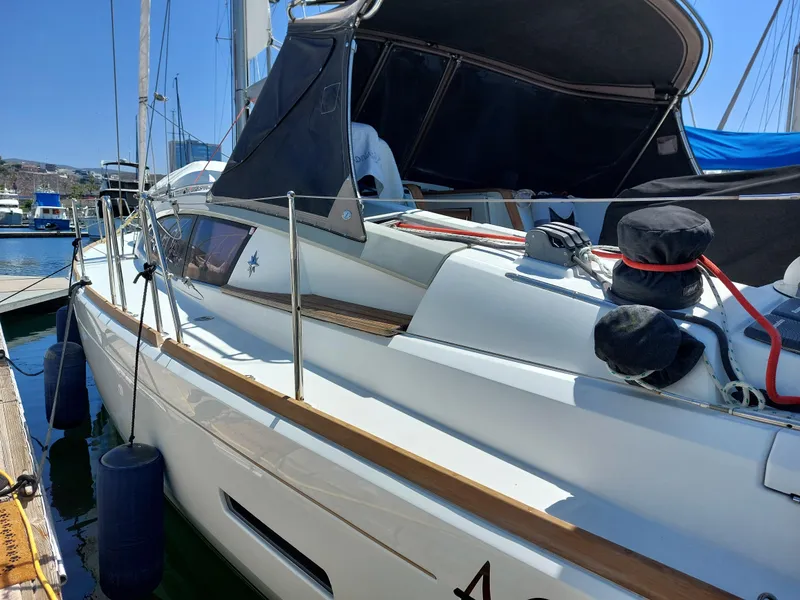 Slide: The Image of 2013 Jeanneau Sun Odyssey 44 DS sailing on calm waters under cloudy skies. - 8