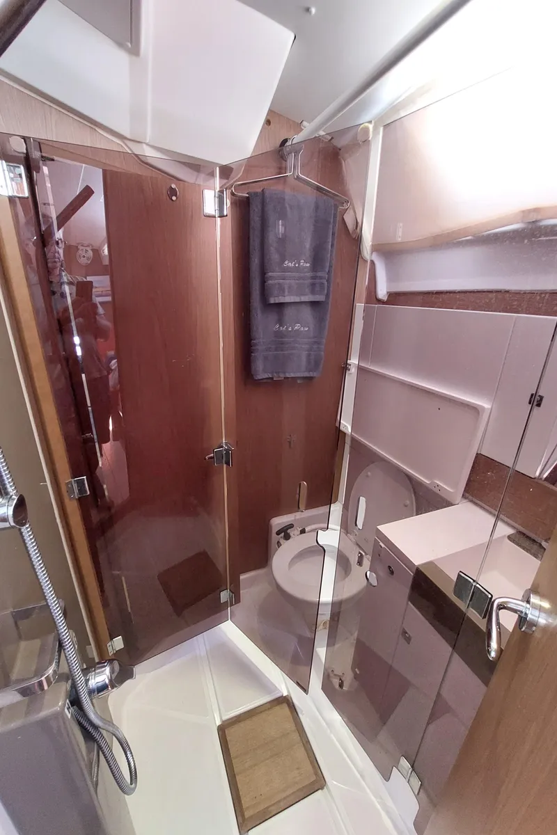 Slide: The Image of Sails of a 2013 Jeanneau Sun Odyssey 44 DS against a clear blue sky. - 98