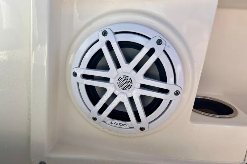 Slide: The Image of 2023 Cobia 200 DC boat speaker, JL Audio, white grille, close-up view. - 14